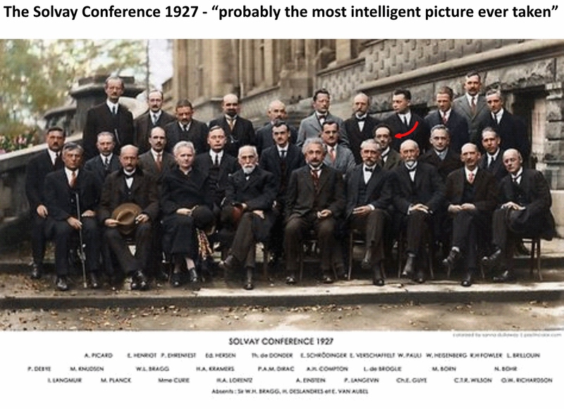 A photograph entitled 'The Solvay Conference 1927 - probably the most intelligent picture ever taken'. Louis de Broglie is highlighted by an arrow.