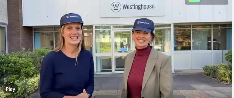 Virginia Crosbie and Trudy Harrison in front of Westinghouse Springfields reception office.